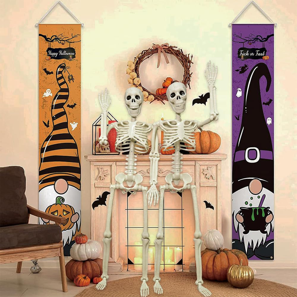 Two CAMIRUS plastic skeletons in a spooky setting