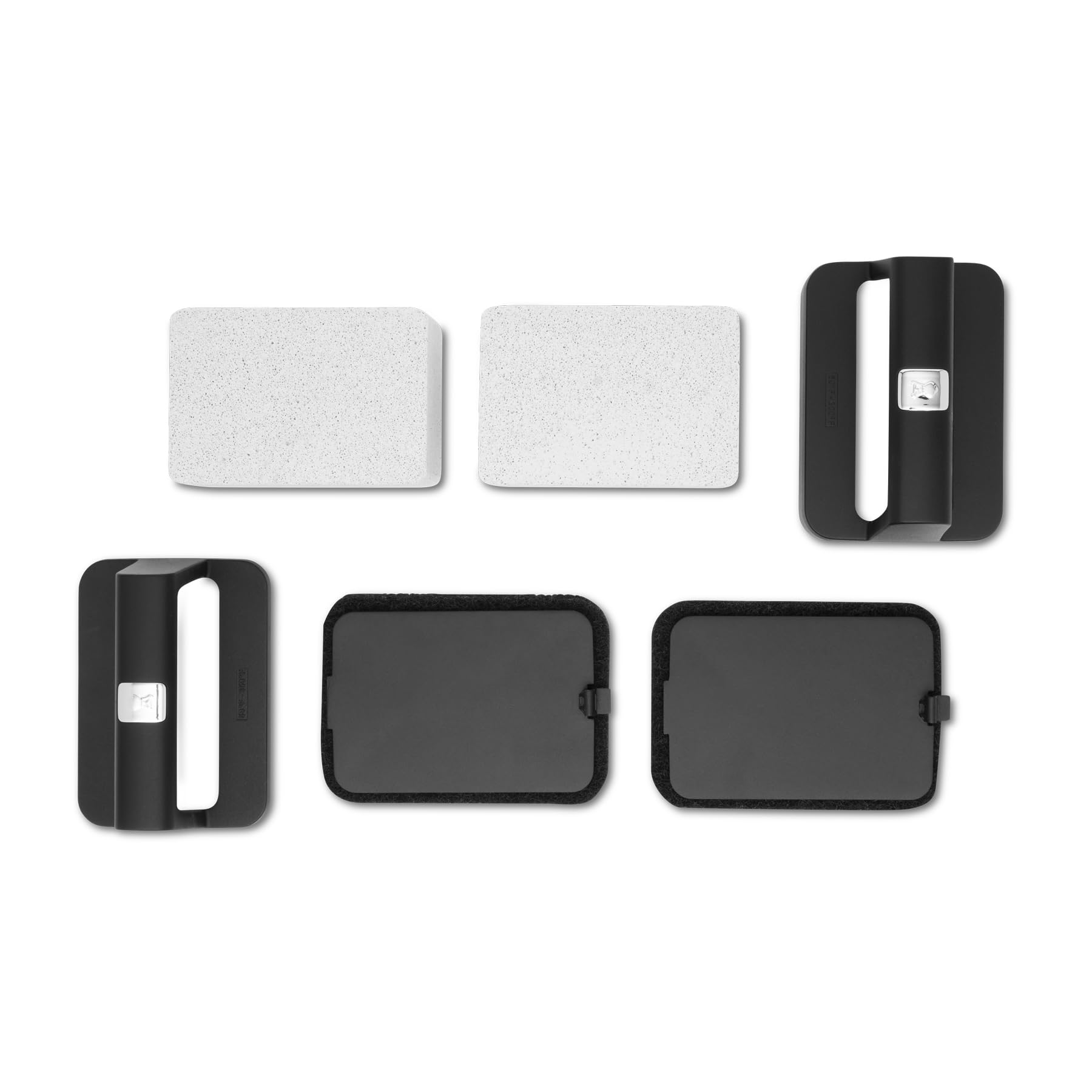 Two cleaning stones from the Weber Griddle Cleaning Kit