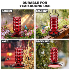 Two Grete Gotye hummingbird feeders hanging in a garden