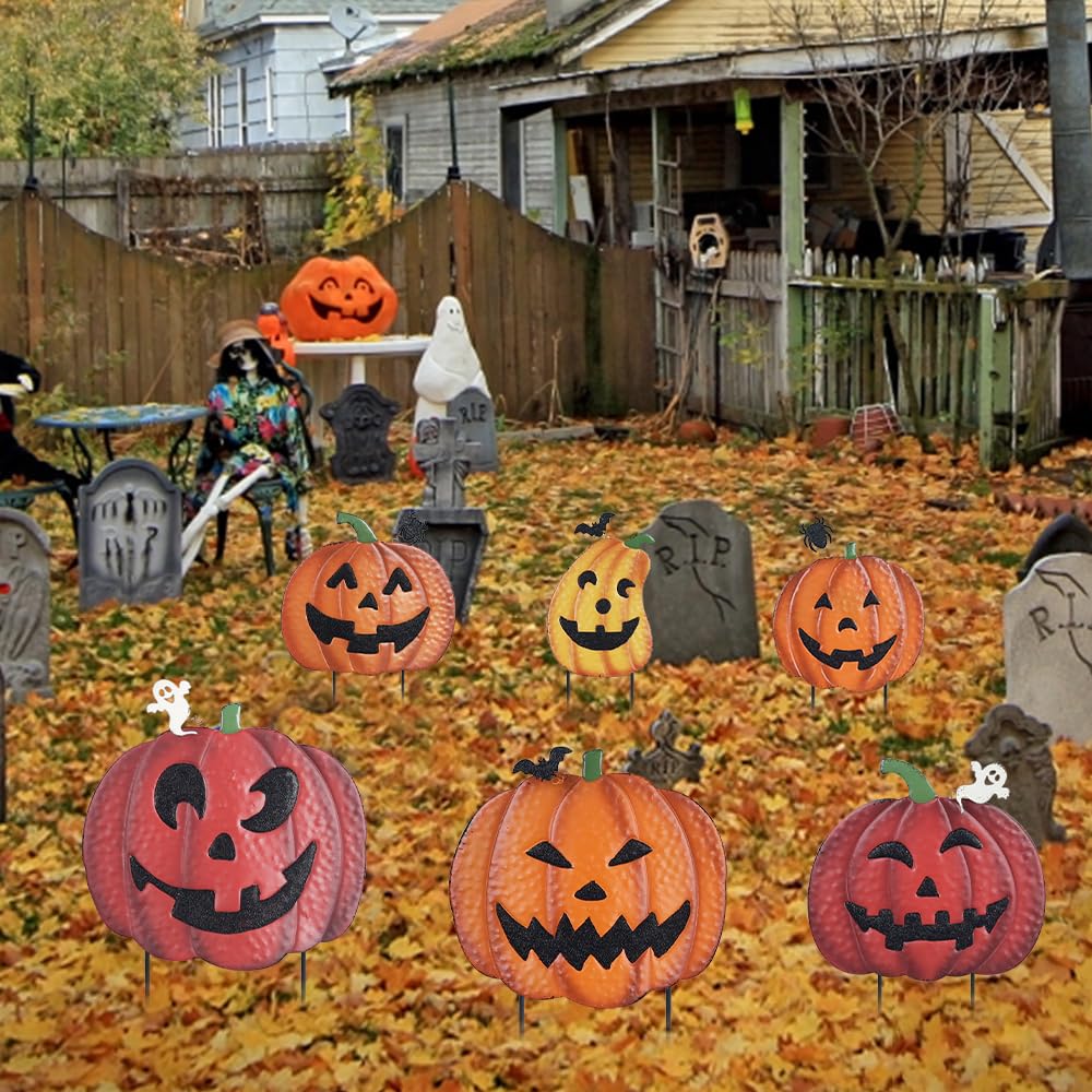 Two Hogardeck metal pumpkin garden stakes with orange finish