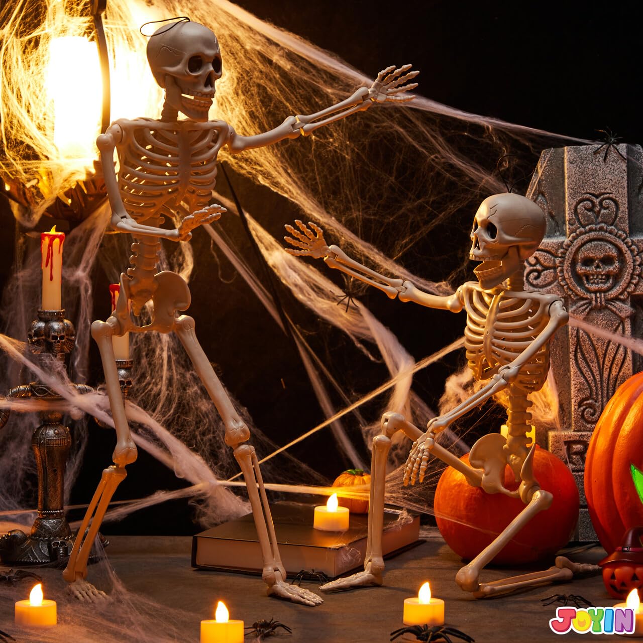 Two JOYIN skeletons displayed in a yard