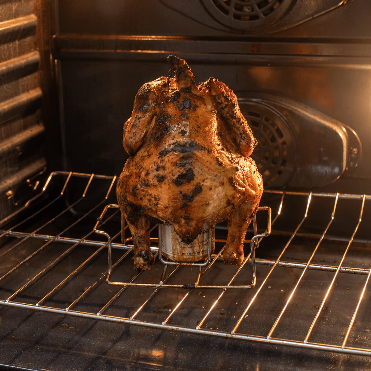 Two Koohere Beer Can Chicken Holders displayed on outdoor table