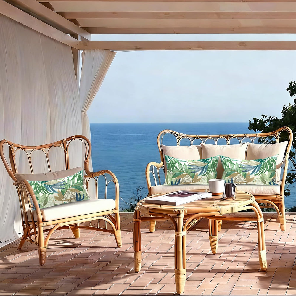 Two LVTXIII lumbar pillows arranged on a modern outdoor couch