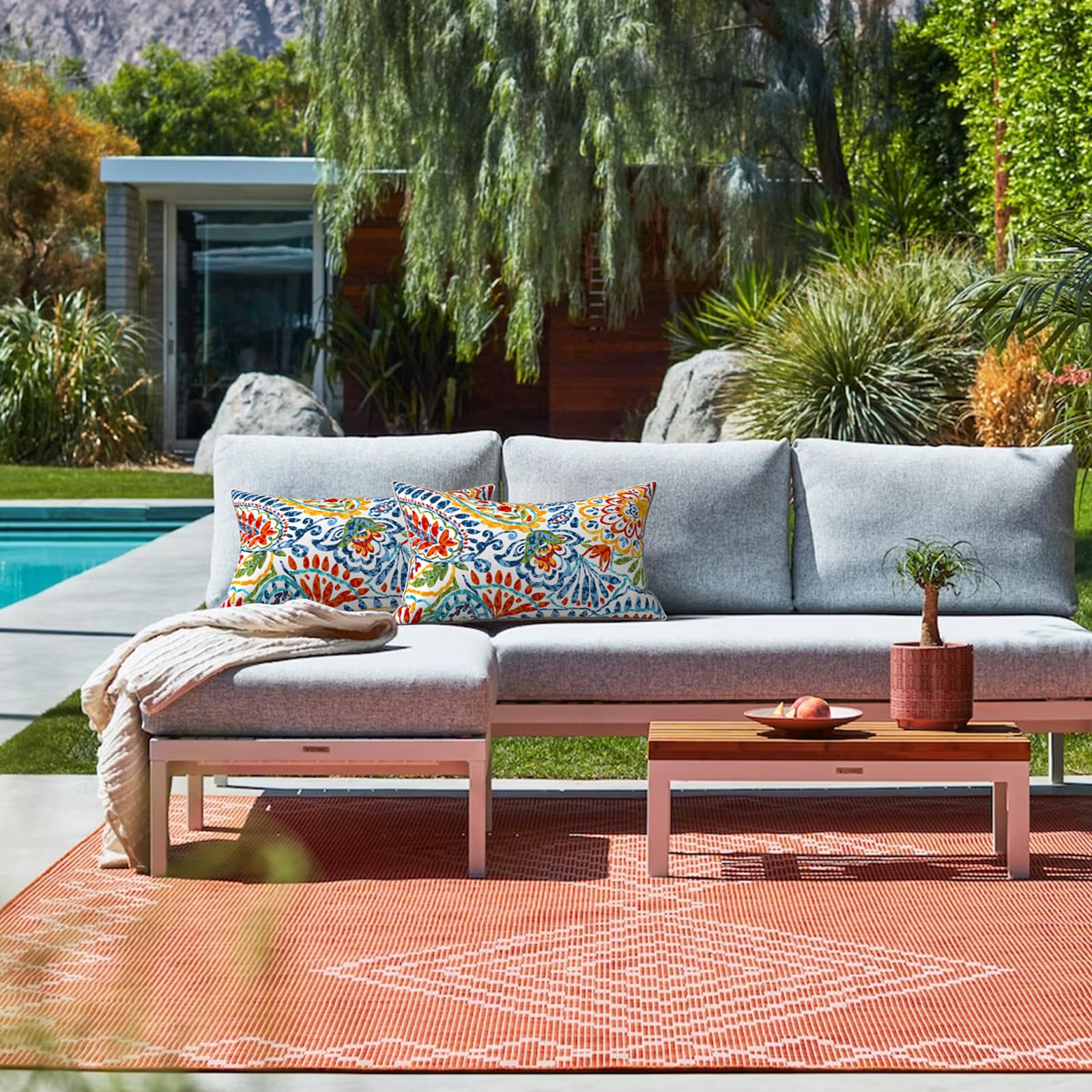 Two LVTXIII Outdoor Lumbar Pillow Covers side by side