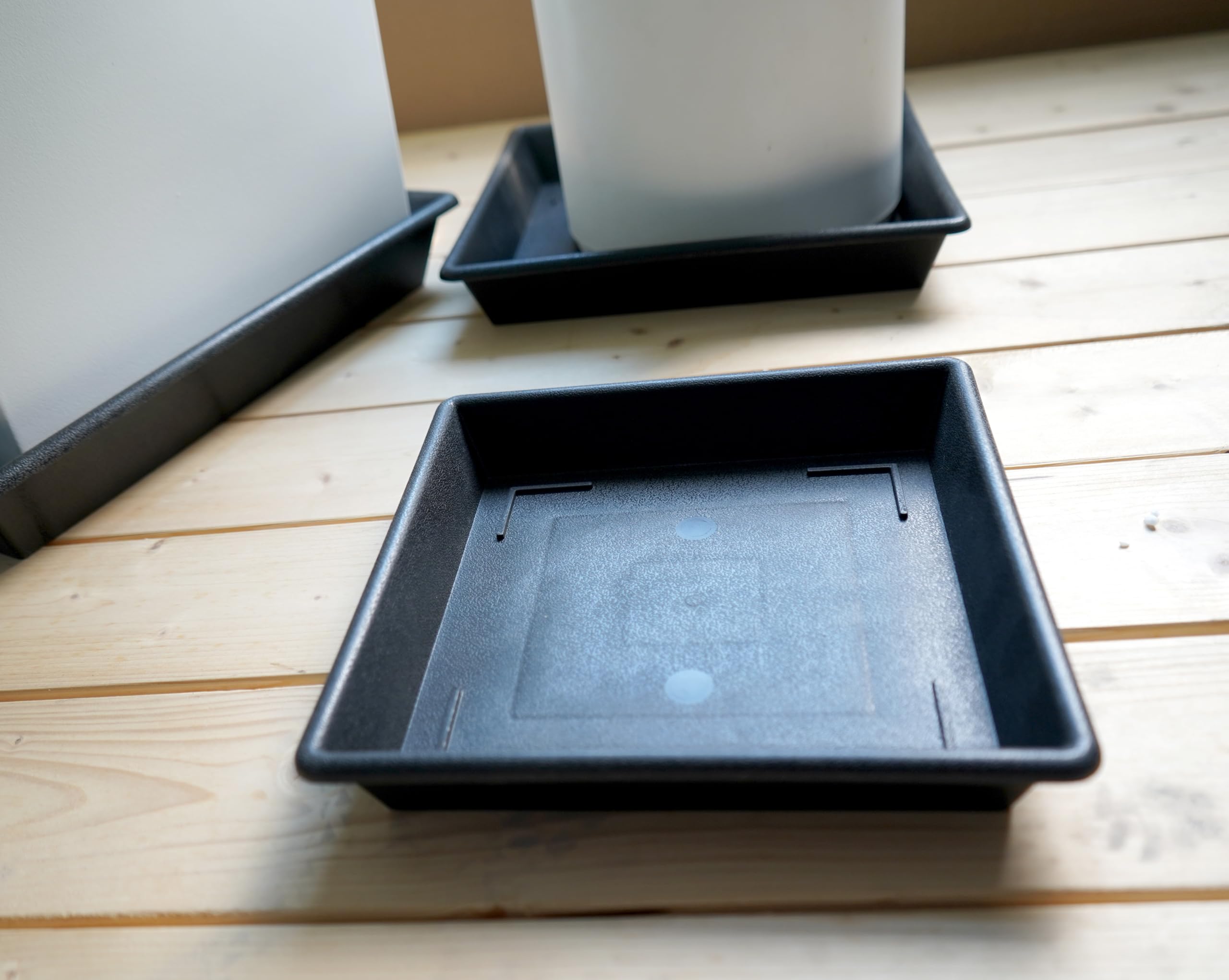 Two NIMYAU 10 Inch square plant saucers stacked