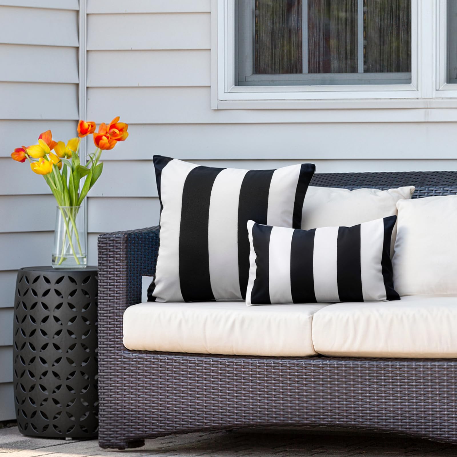 Two Outdoor Waterproof Striped Pillow Covers on a garden bench
