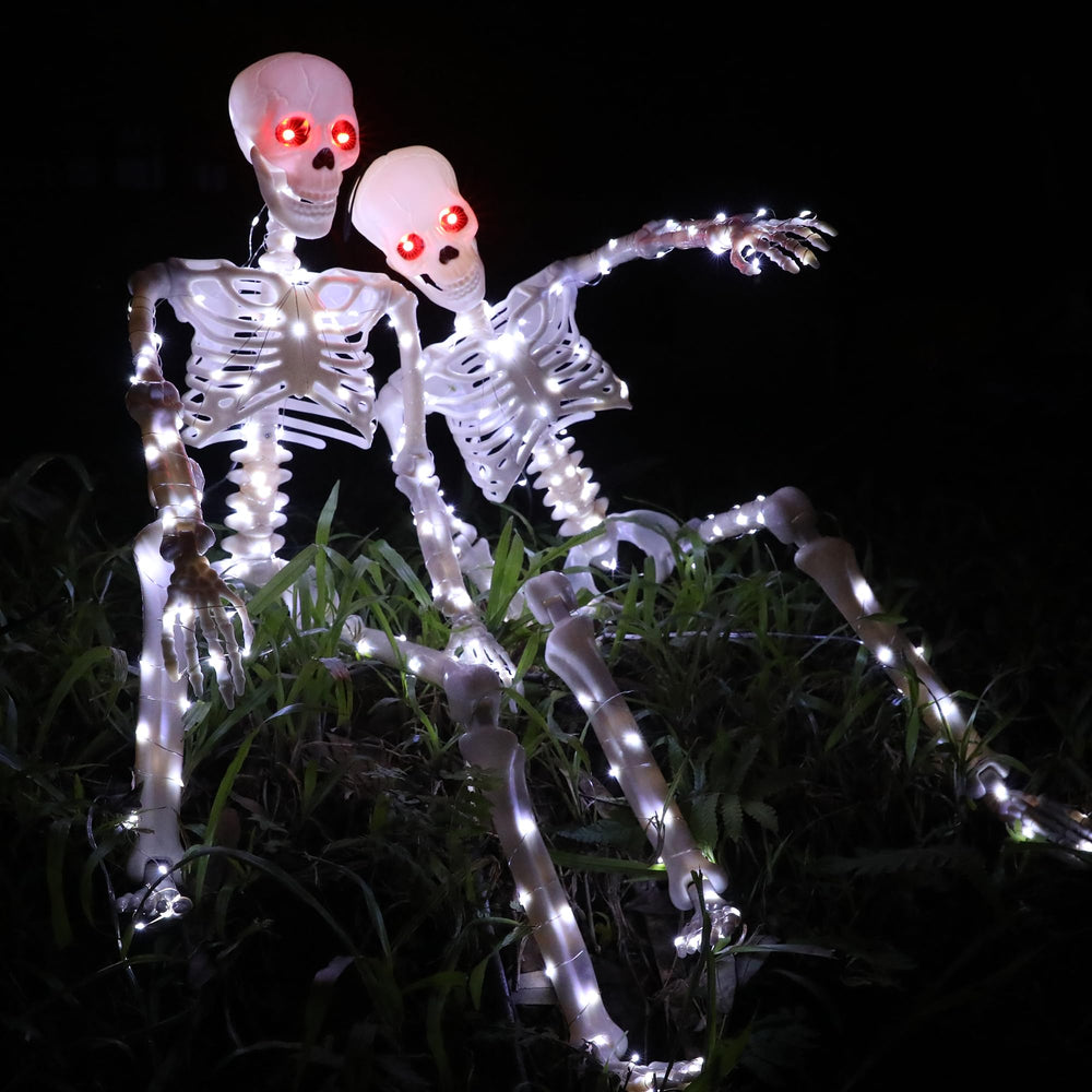 Two Starweeks skeletons standing on a porch, ready for Halloween