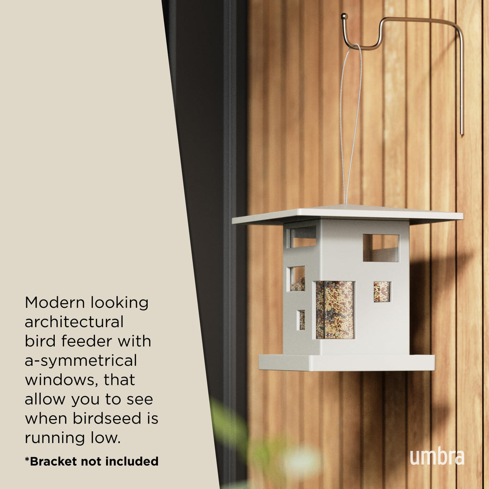 Umbra Bird Cafe Bird Feeder hanging in garden