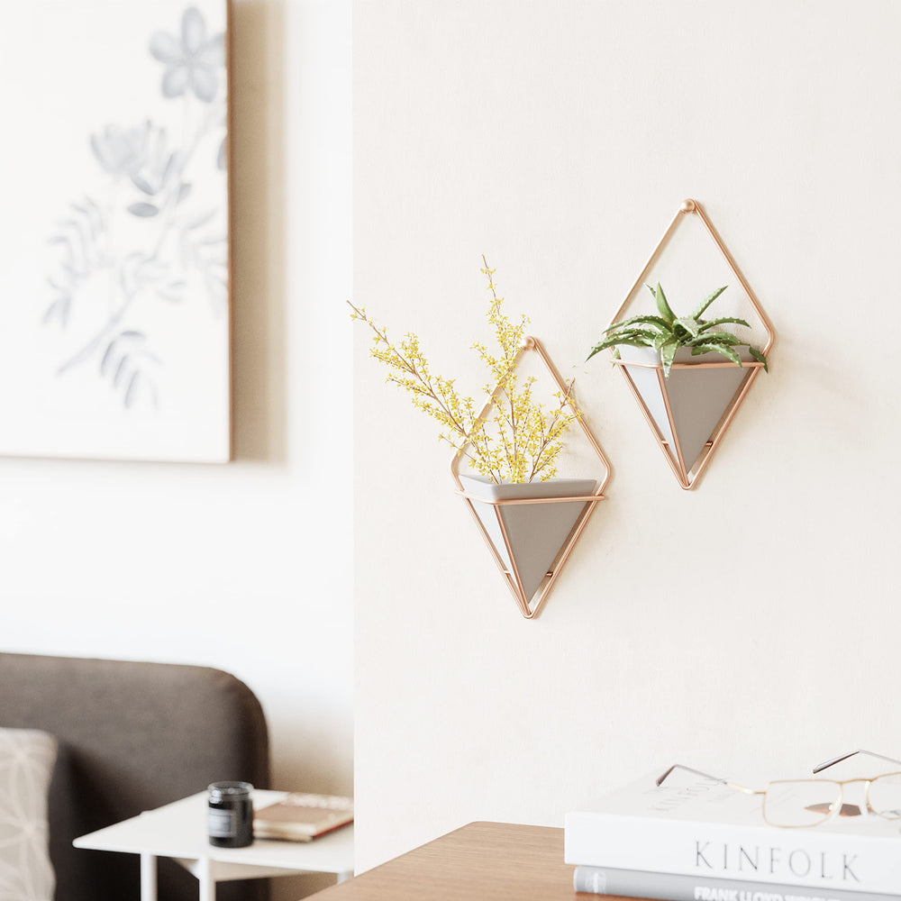 Umbra Trigg Hanging Planter displaying office supplies