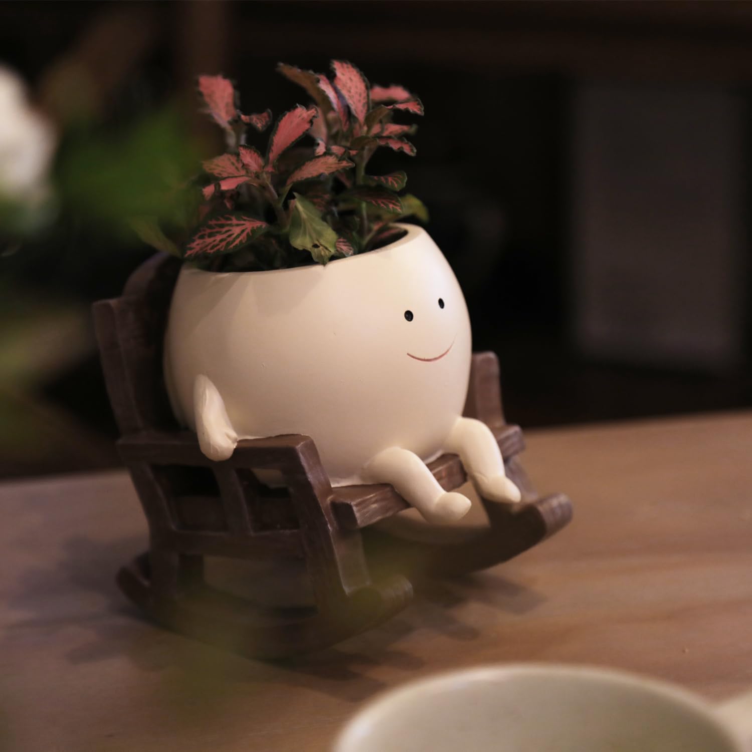 UMESONG Smiling Face Planter Pot on a patio
