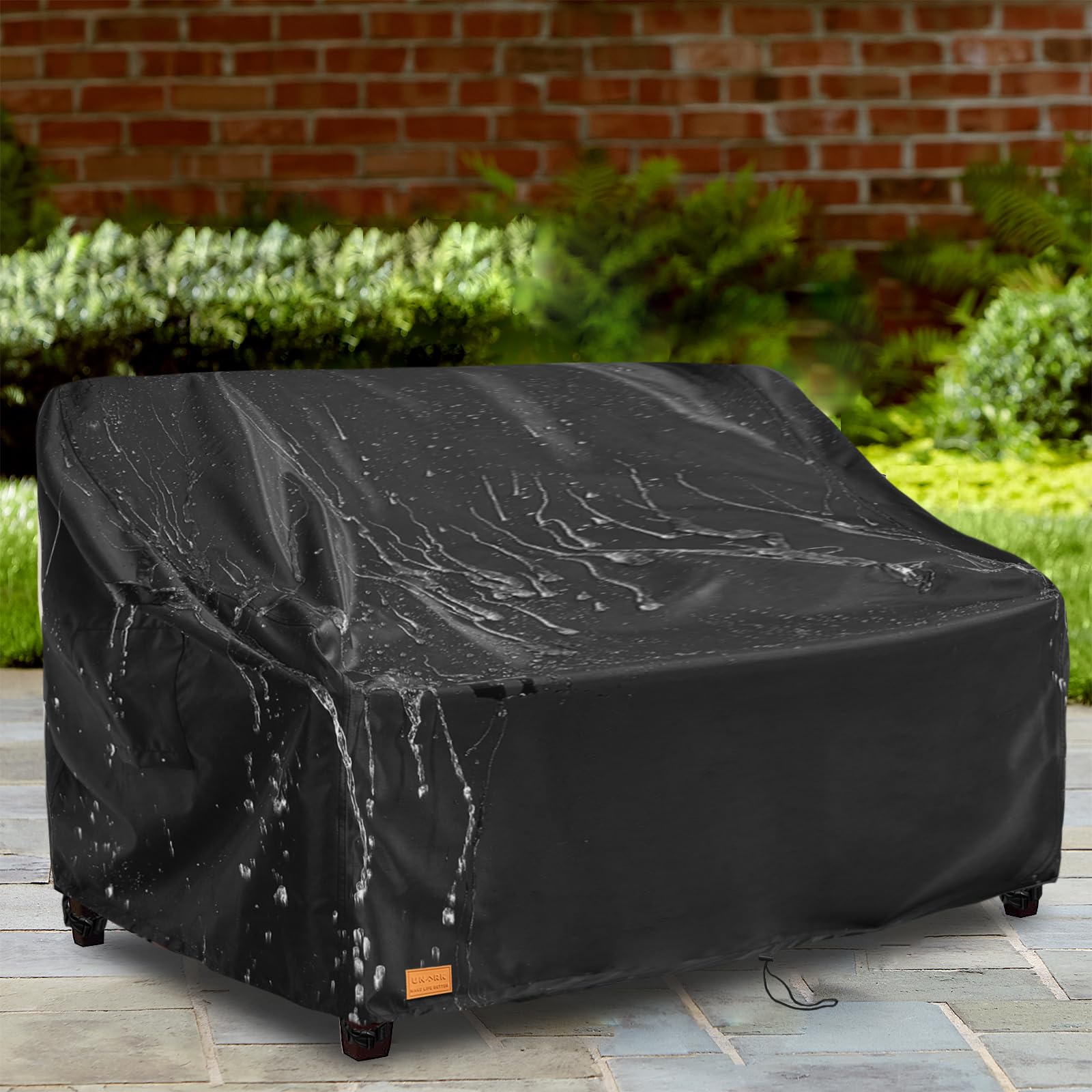 UNARK sofa cover protecting an outdoor sofa from rain