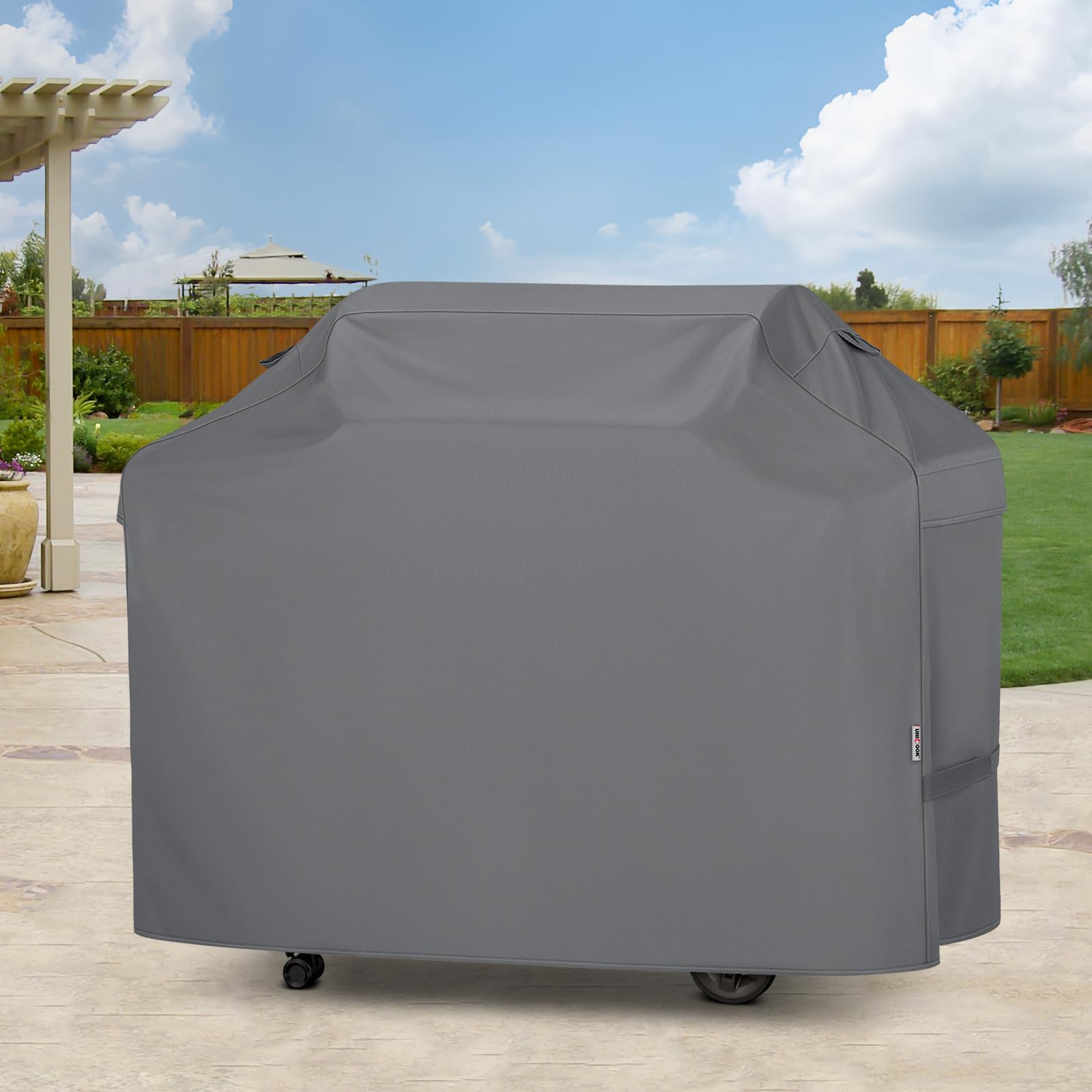Unicook Grill Cover in gray against outdoor elements
