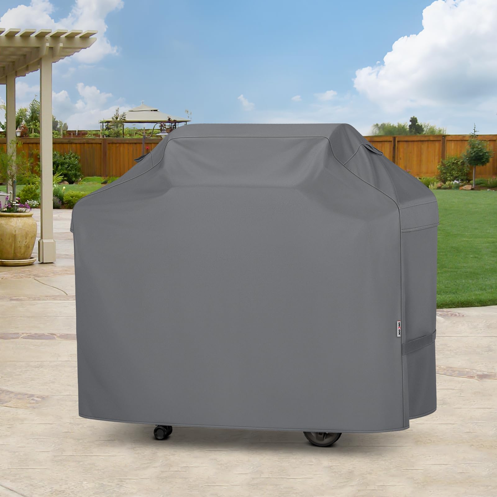 Unicook Grill Cover in use during outdoor grilling setup