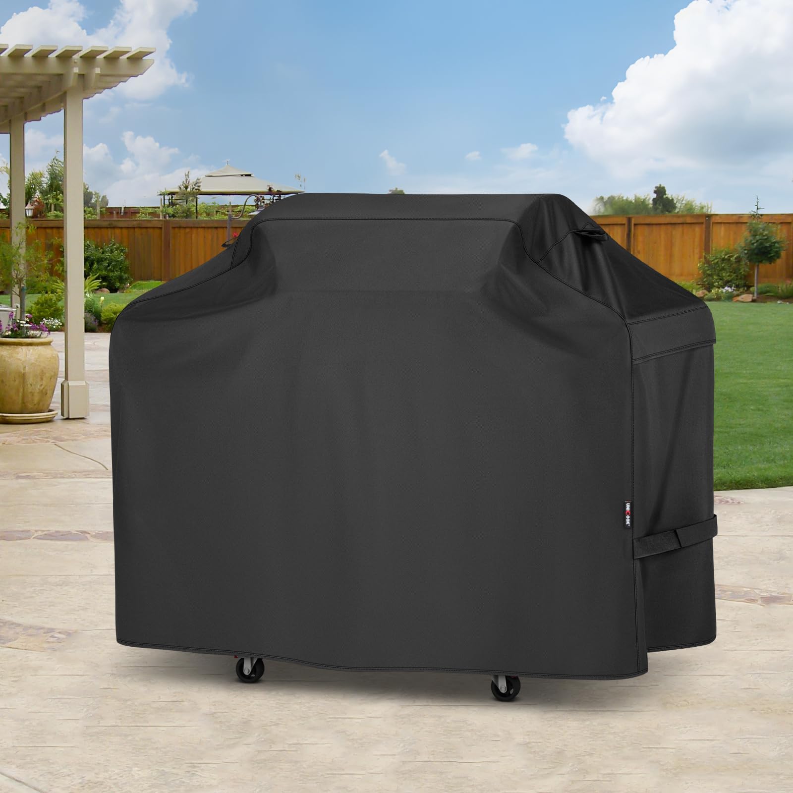Unicook Heavy Duty Waterproof Grill Cover laid flat on ground