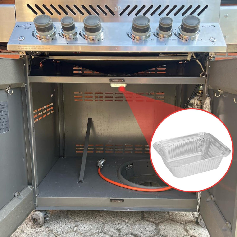 Used WEBROIL grill liner ready for disposal