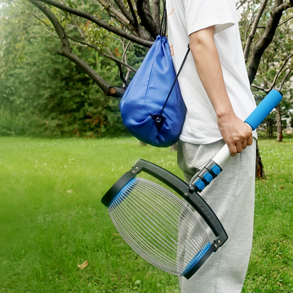 User holding the soft handle of the zozen Nut Gatherer