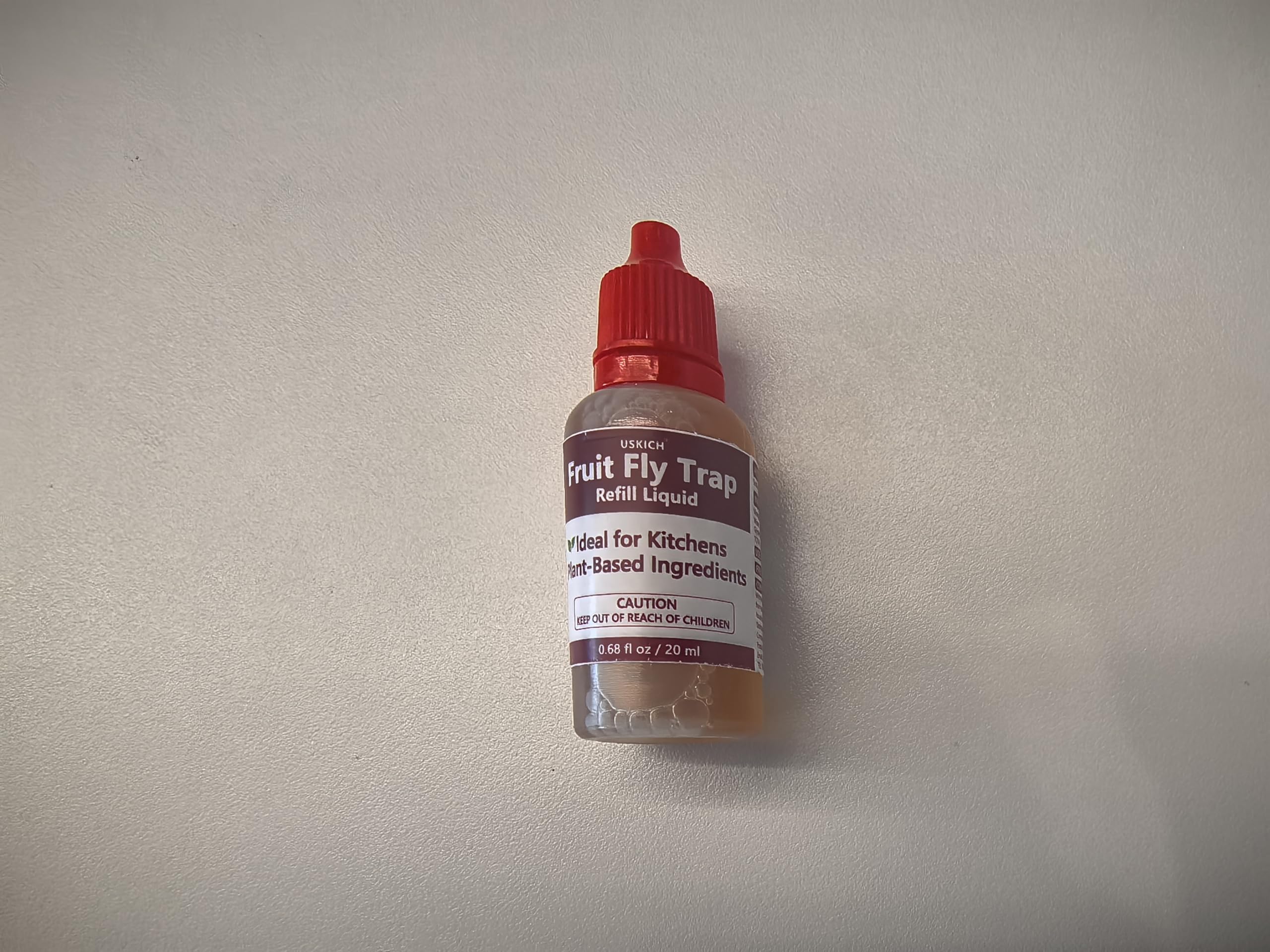 USKICH Fruit Fly Trap Refill Liquid bottles arranged