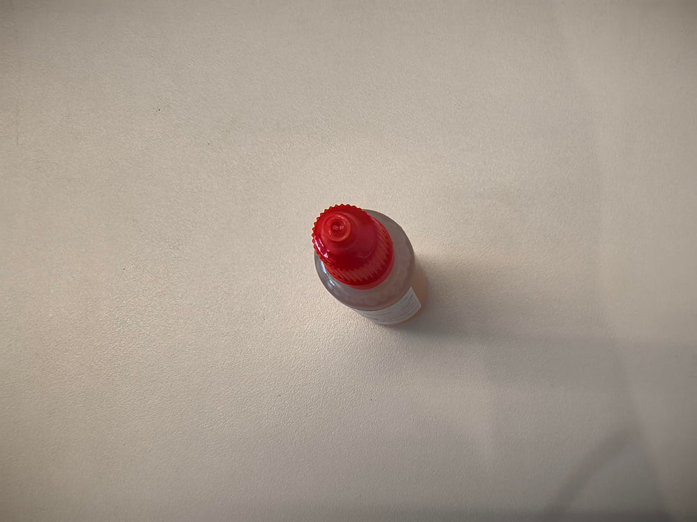USKICH Fruit Fly Trap Refill Liquid with fruits in background