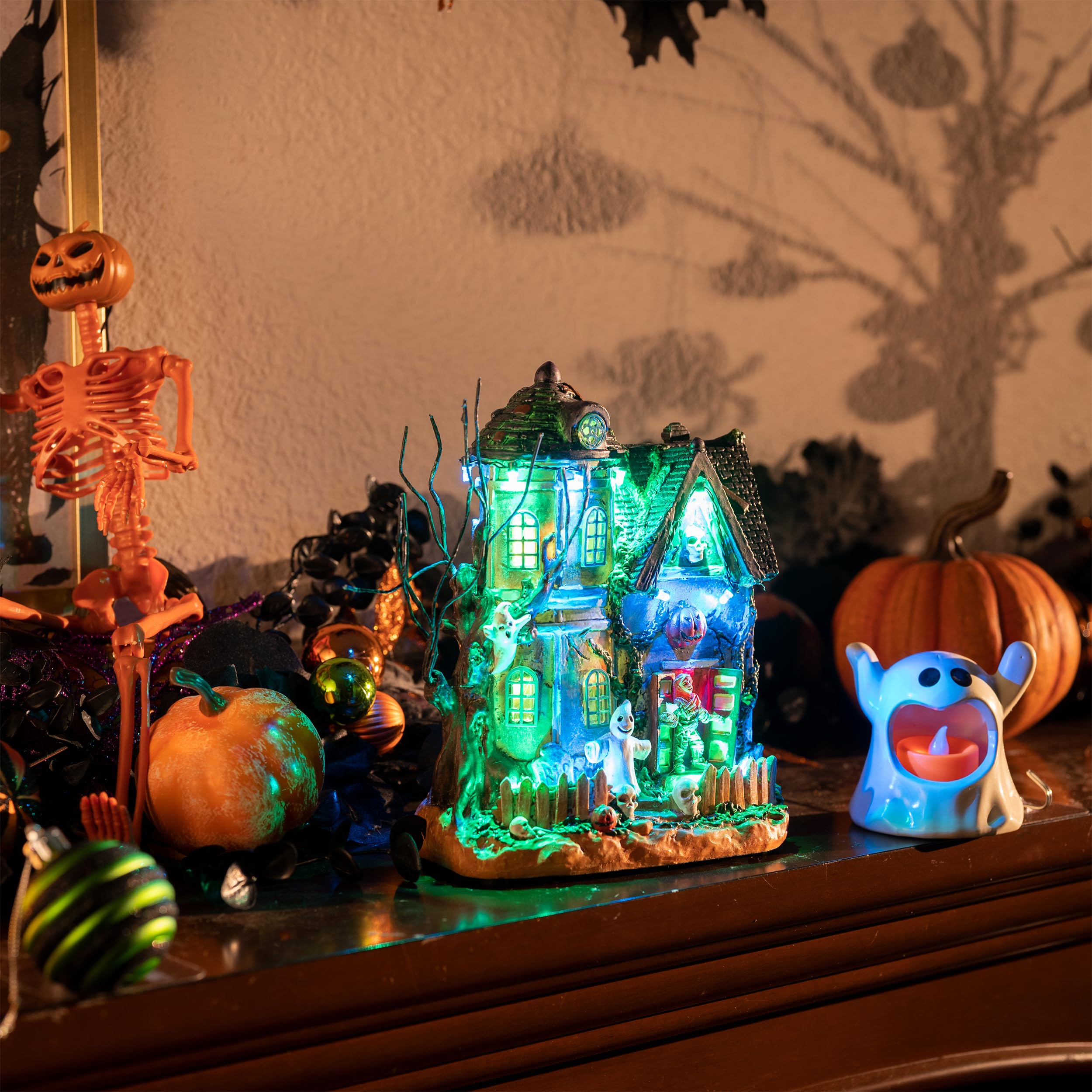 Valery Madelyn Halloween Village House displayed on a mantel