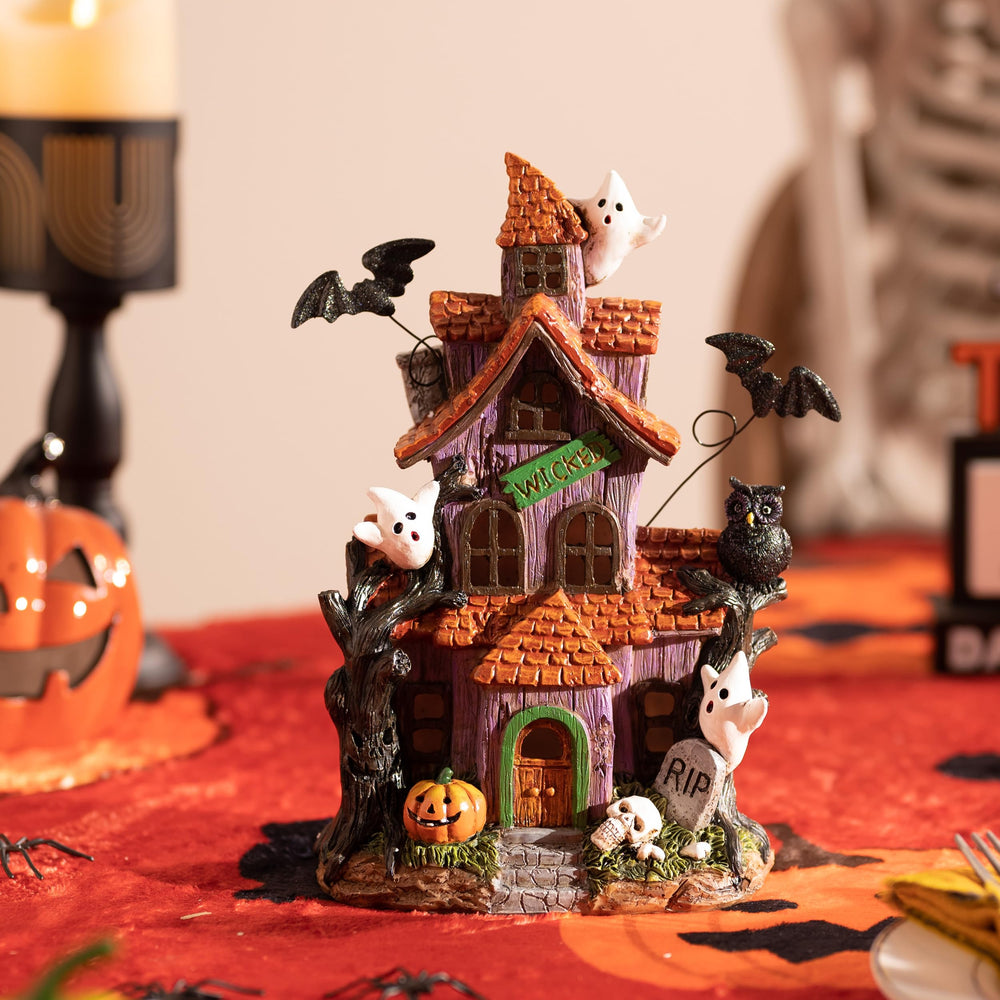 Valery Madelyn Halloween Village House displayed with other Halloween decorations