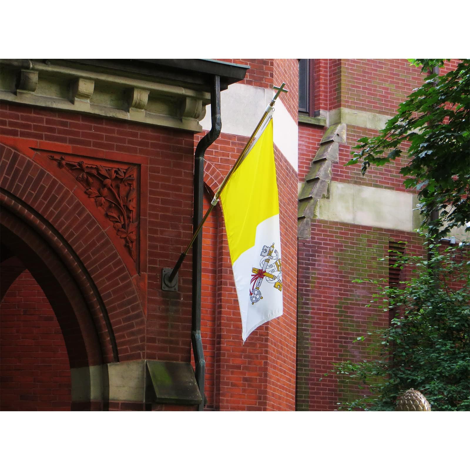 Vatican Flag hanging on a porch