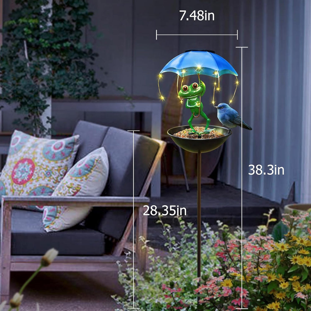Vbioa Solar Bird Feeder Frog Garden Decor in a garden setting