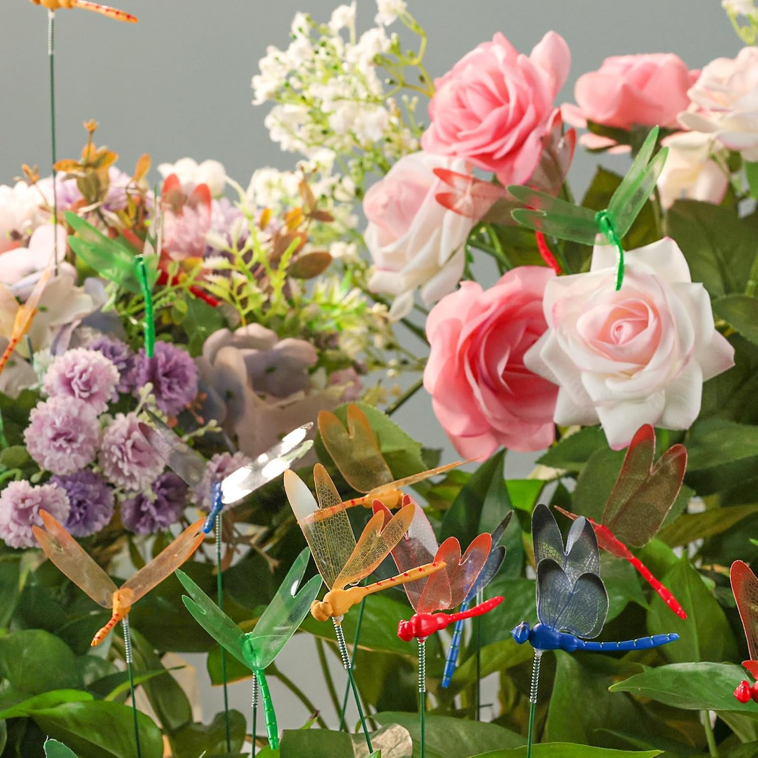 VGOODALL dragonfly stakes arranged in a lawn