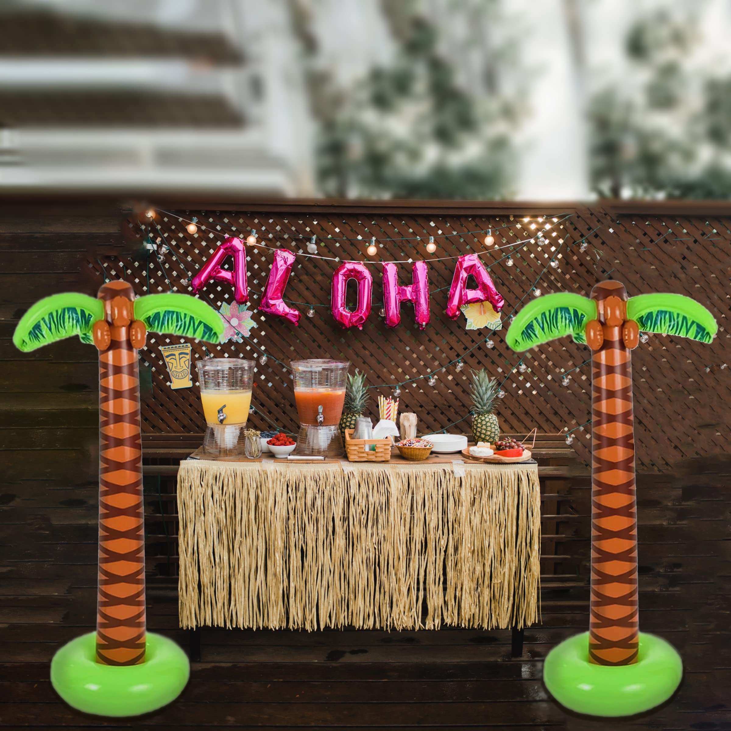 Vibrant green inflatable palm trees at a summer event