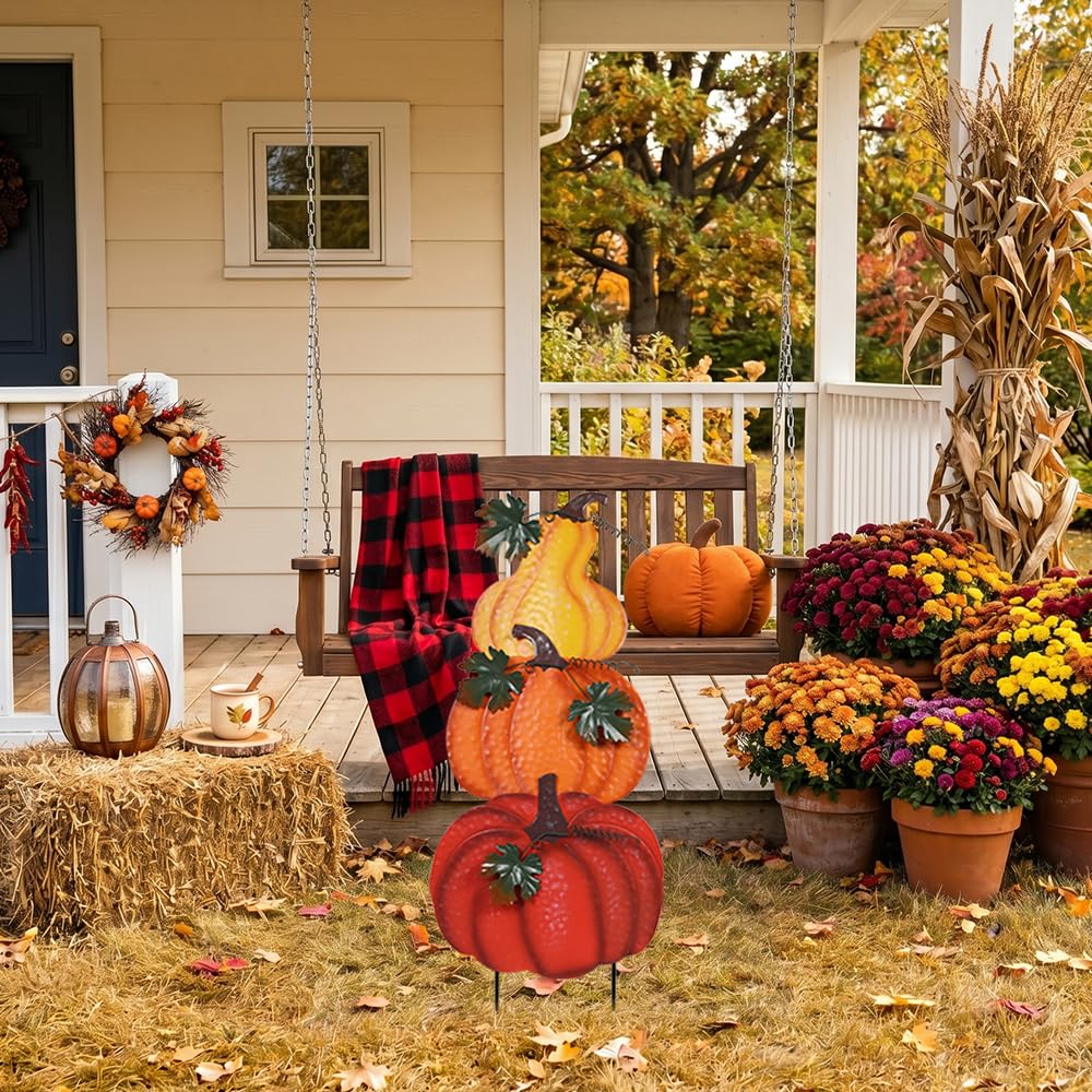 vibrant yellow pumpkin garden stakes outdoors
