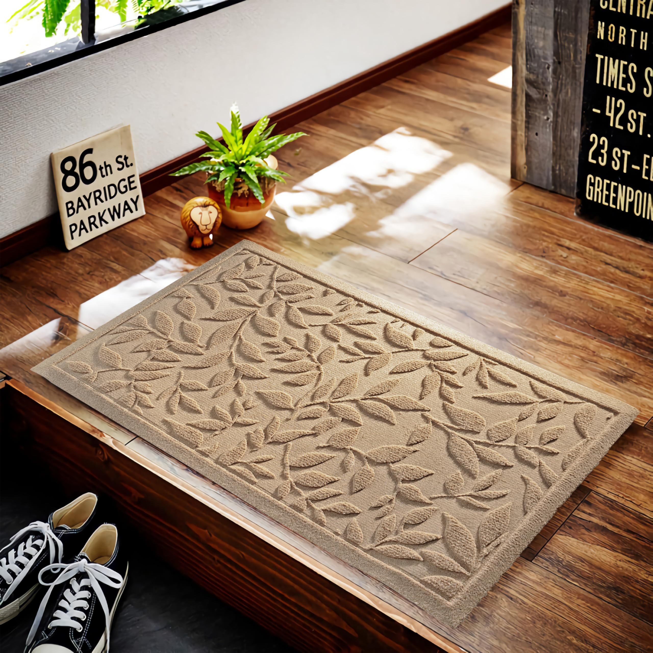 VivaNest doormat on a porch, showcasing its leaf design