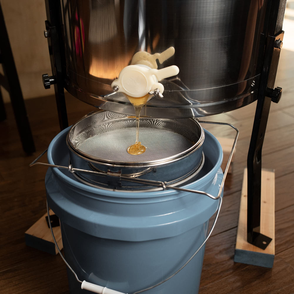 VIVO honey strainer being cleaned with cold water