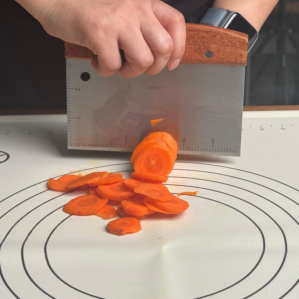Vovoly Bench Scraper next to a bowl of prepared ingredients