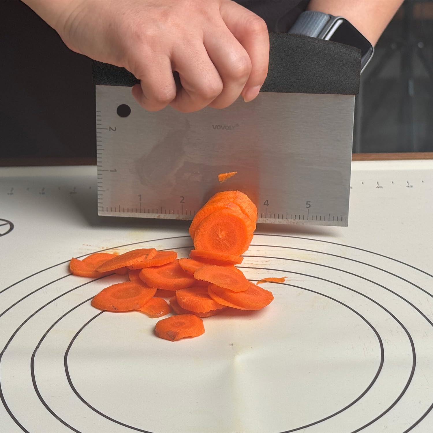 Vovoly Bench Scraper next to a griddle and spatula