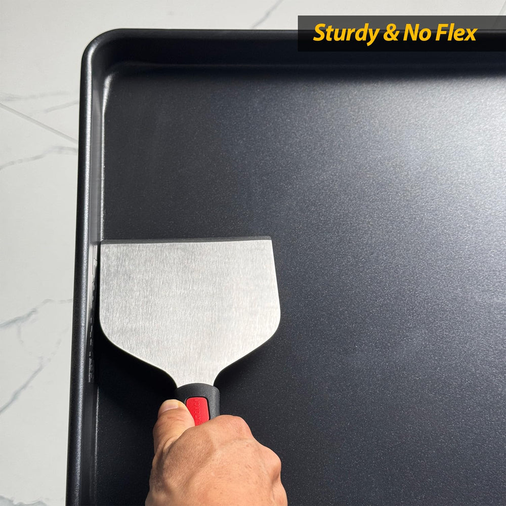 Vovoly griddle scraper displayed on a clean griddle surface