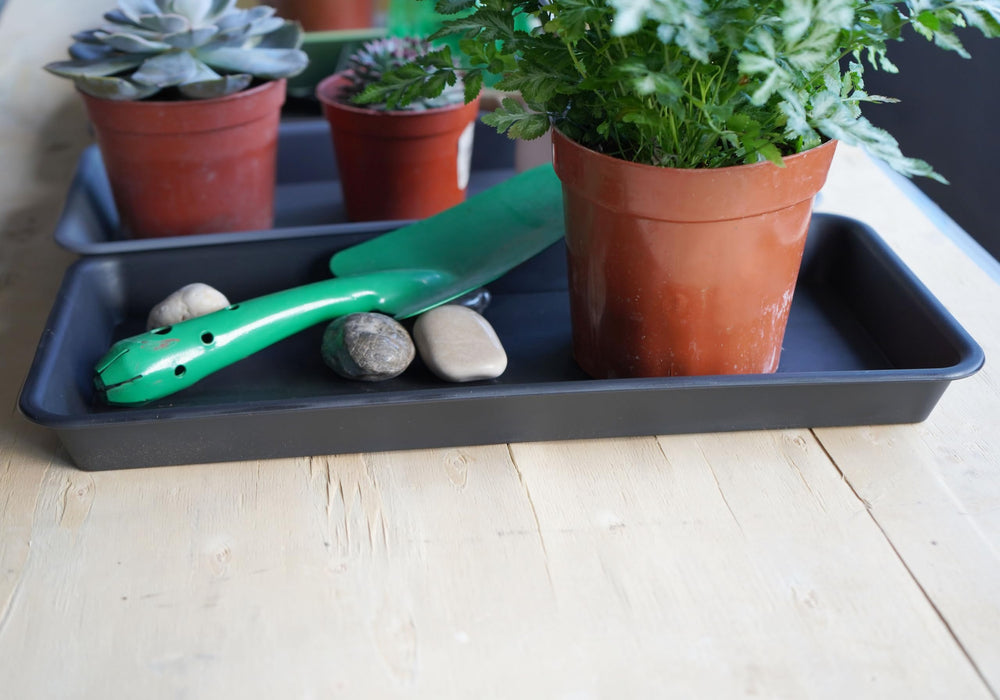 VUWEZ trays stacked together, demonstrating compact storage