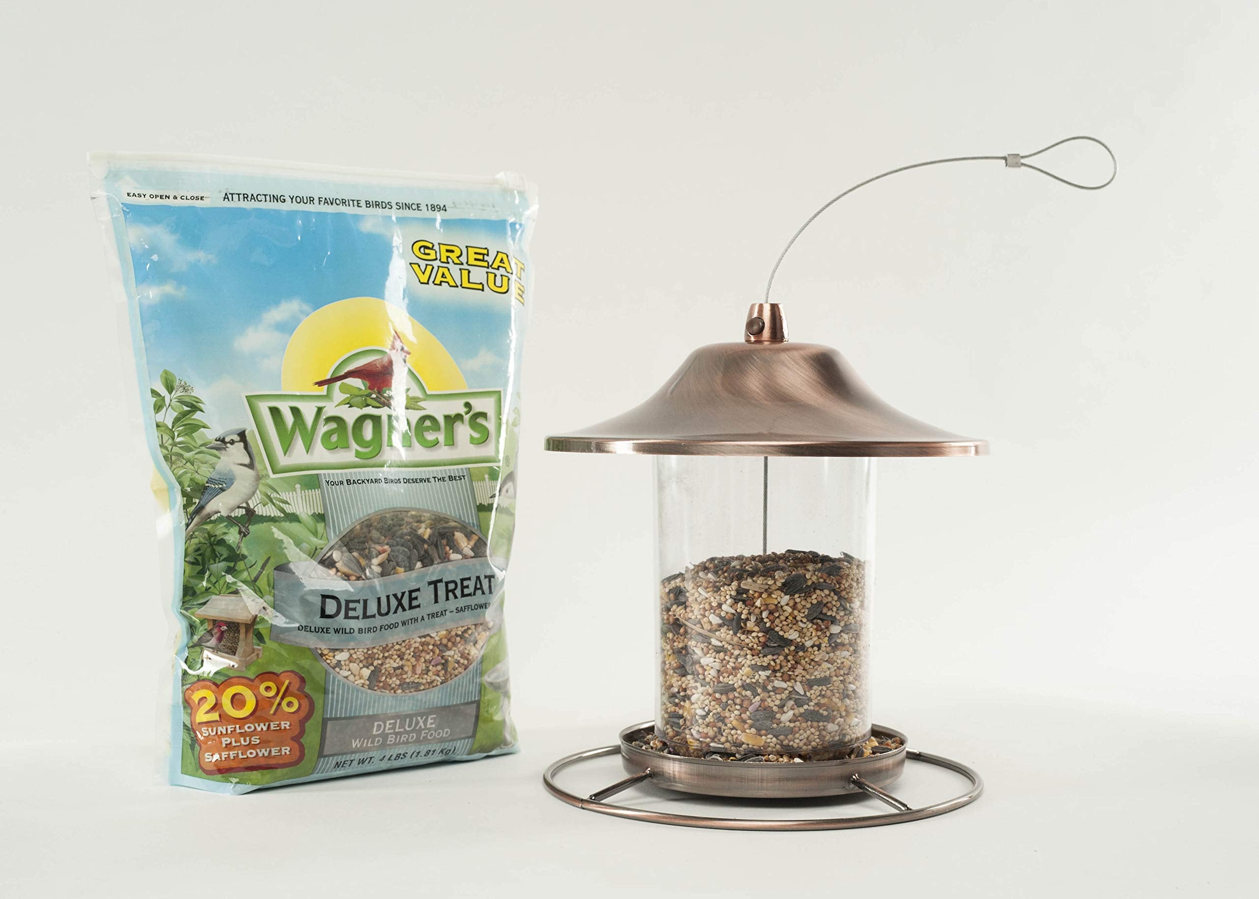 Wagner's Deluxe Blend Wild Bird Food packaging on a garden table