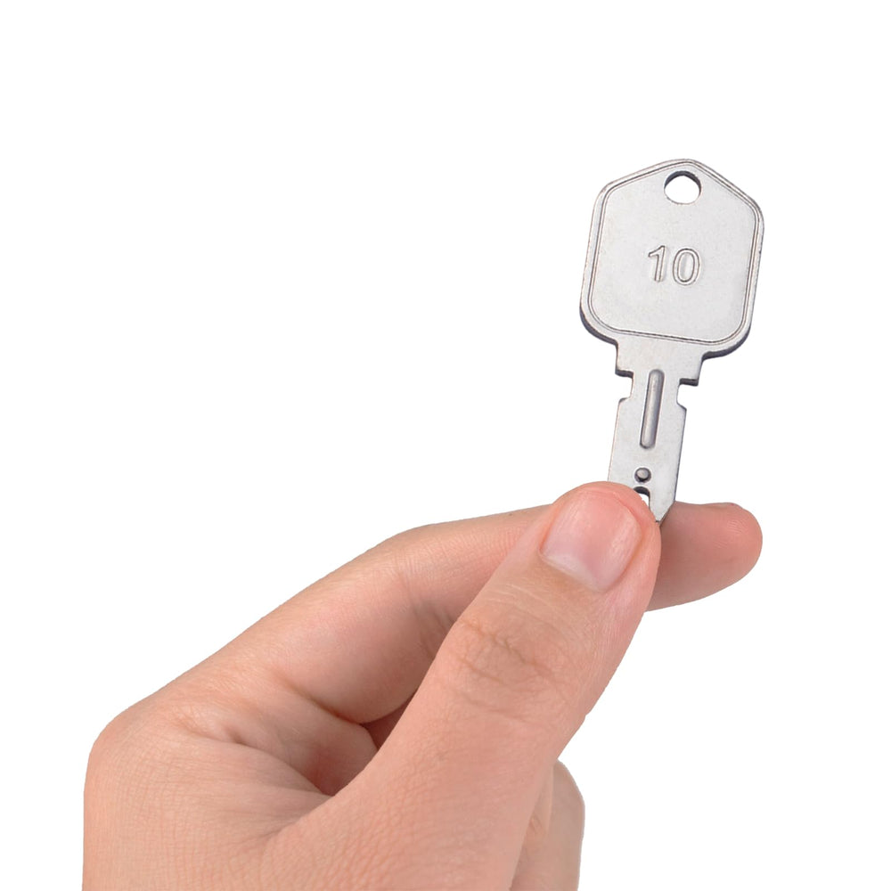 WAHLIN PARTS ignition key next to construction equipment