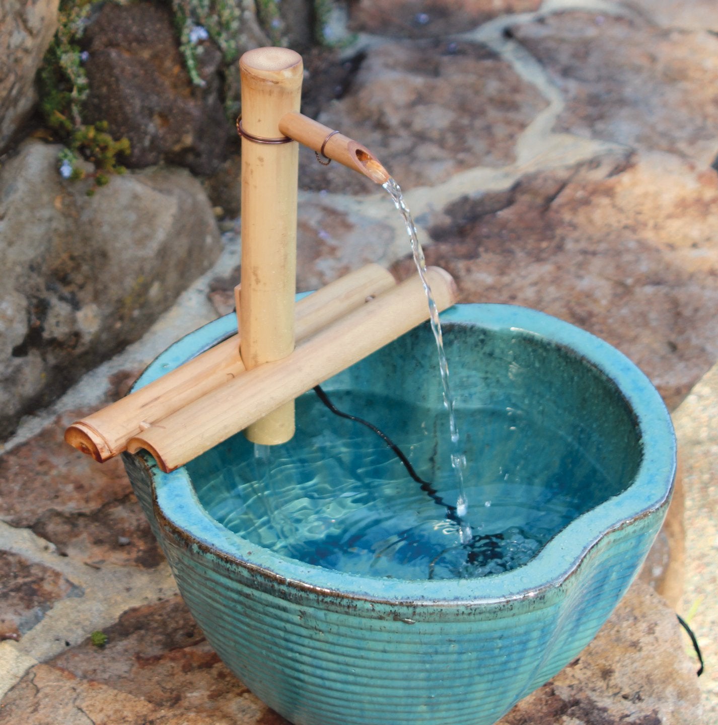 Water flowing from the bamboo fountain