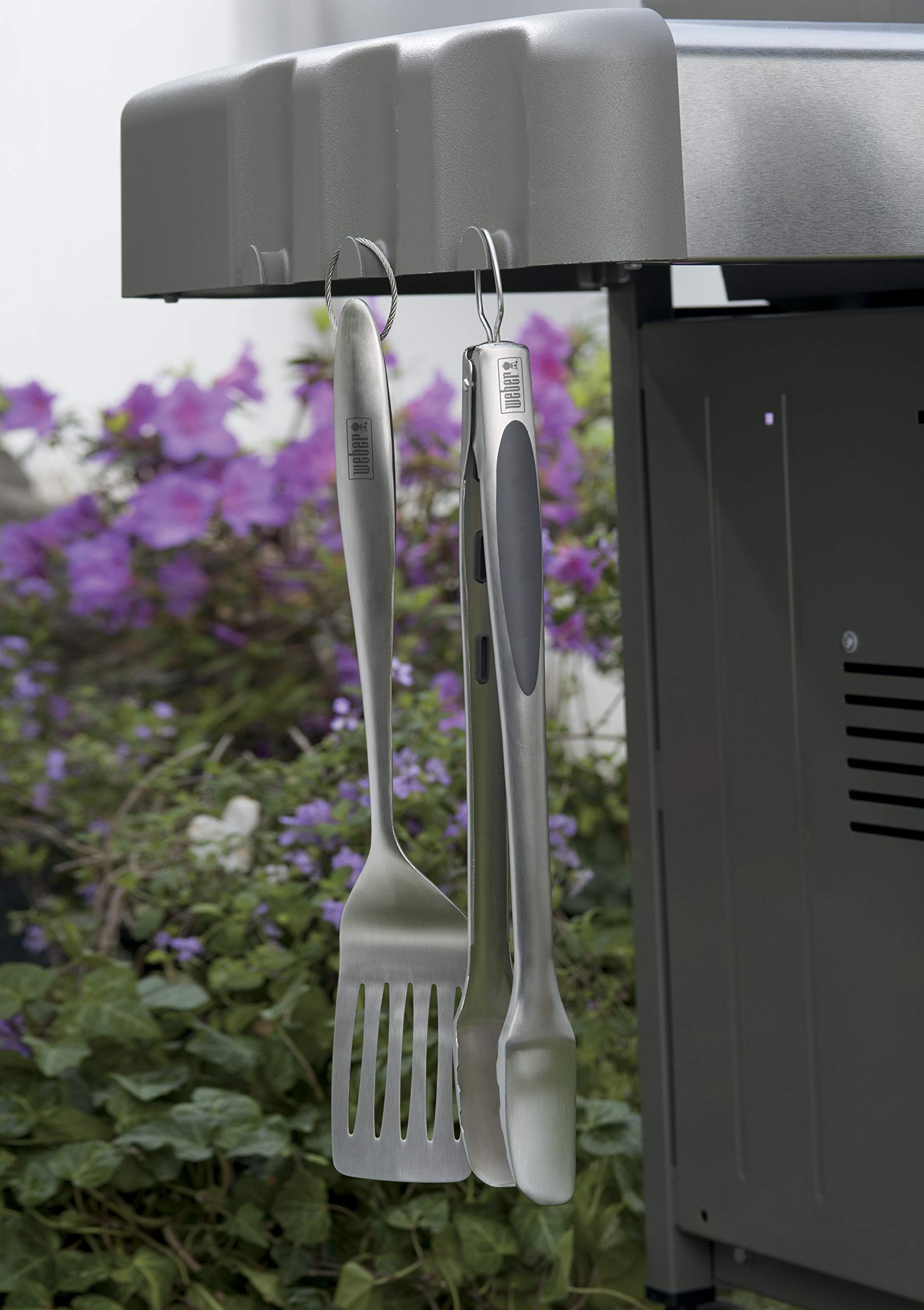 Weber barbecue tool set in action grilling burgers
