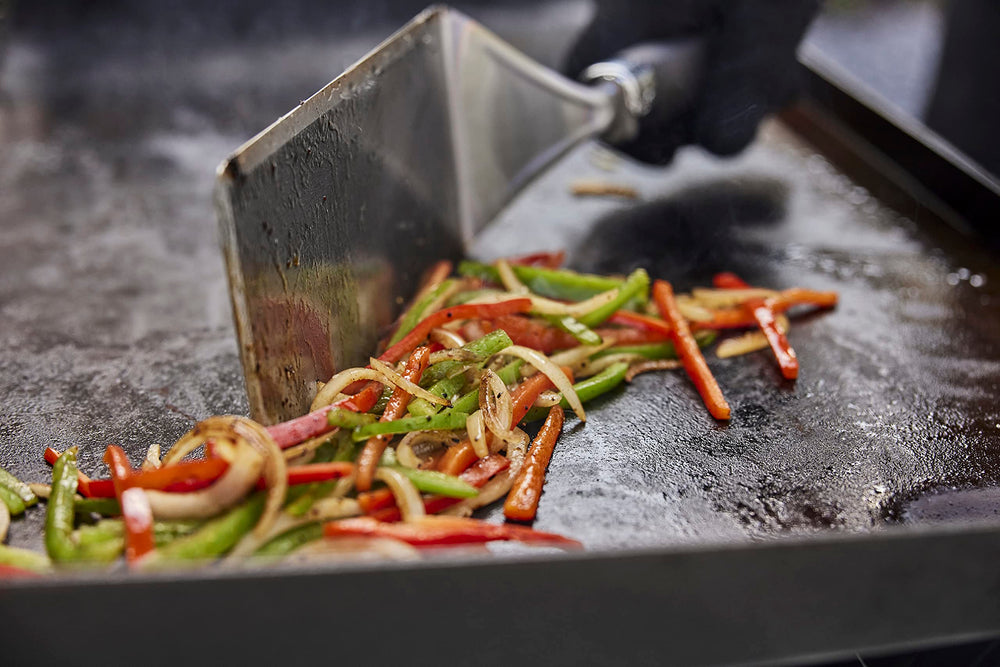 Weber Griddle Scraper close-up on stainless steel