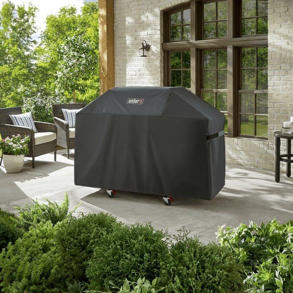 Weber grill cover with fastening straps for secure fit