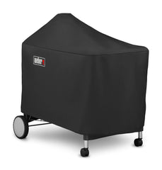 Weber Grill Cover with Velcro strap secured on a grill