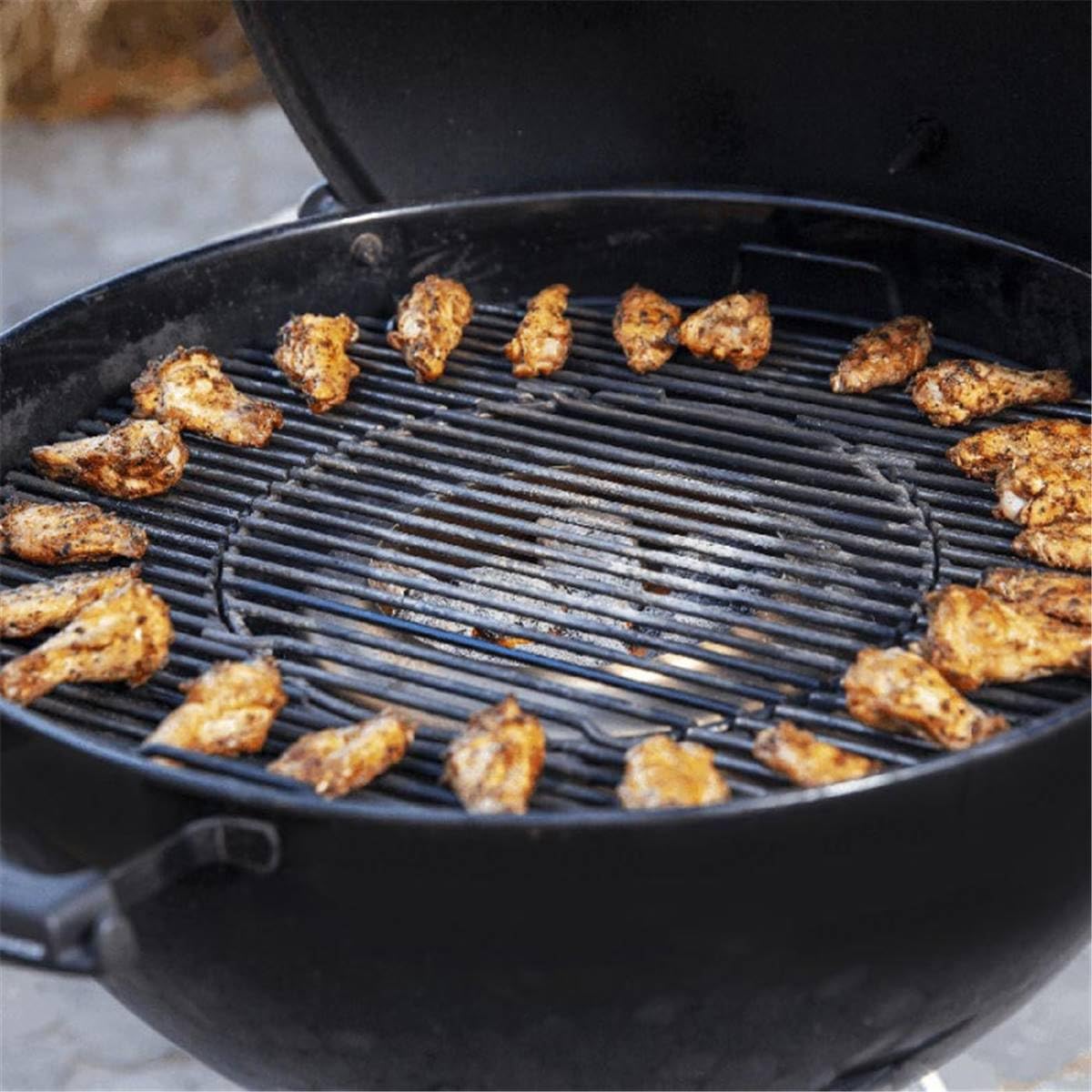 Weber heat controller in use on a kettle grill with food