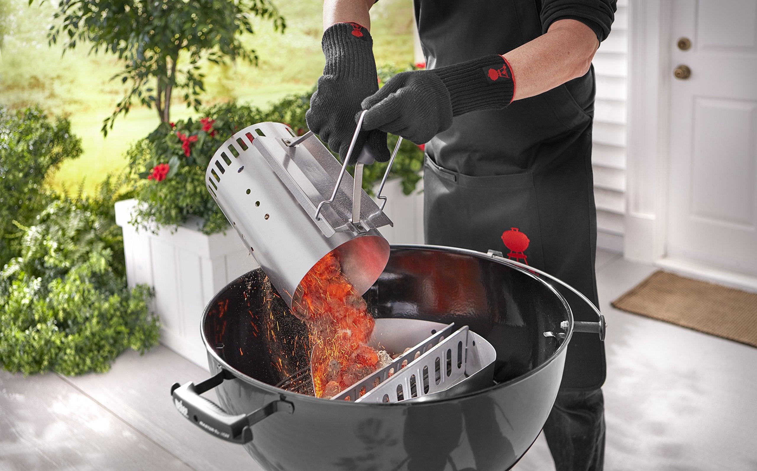 Weber Rapidfire Chimney Starter filled with charcoal ready for use