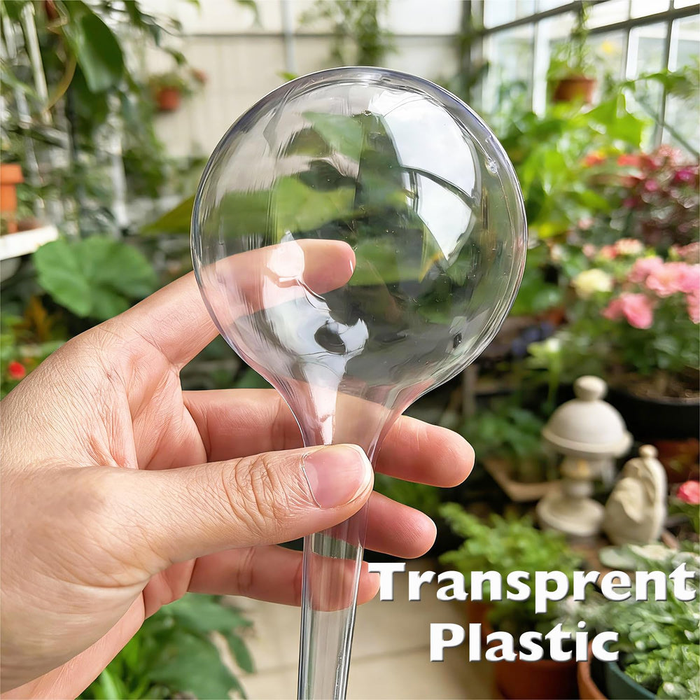 Wellinc self watering globes inserted in various potted plants