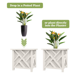 White outdoor planter box with flowers in a garden