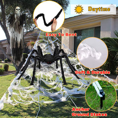 Wide shot of Halloween decorations featuring the lighted spider web