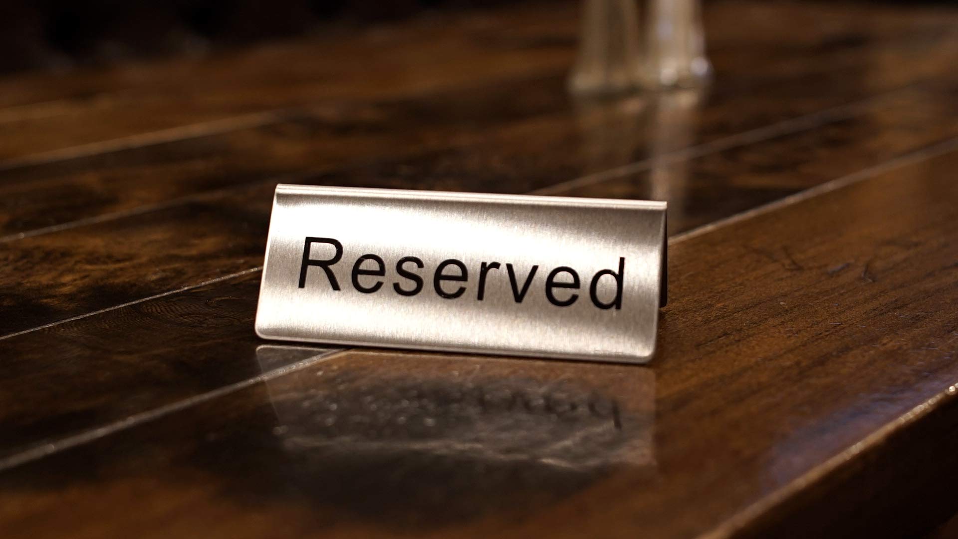 Winco Reserved Table Signs in a banquet setting