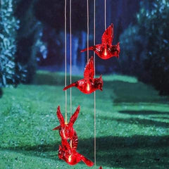 Wind chime hanging in a garden setting