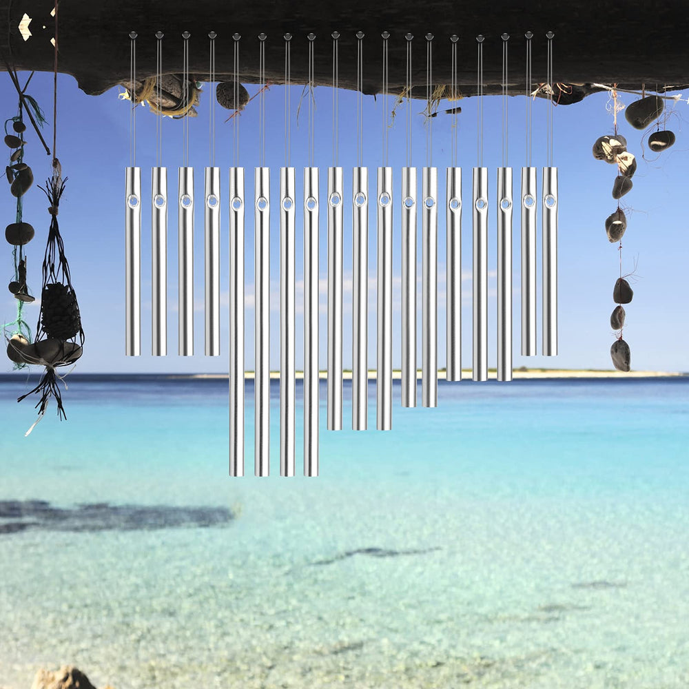 wind chime tubes hanging in a garden setting